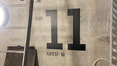 Signage vinyl lettering on wall showing floor number