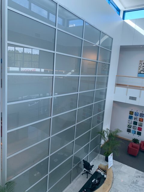 tall office wall with glass decor